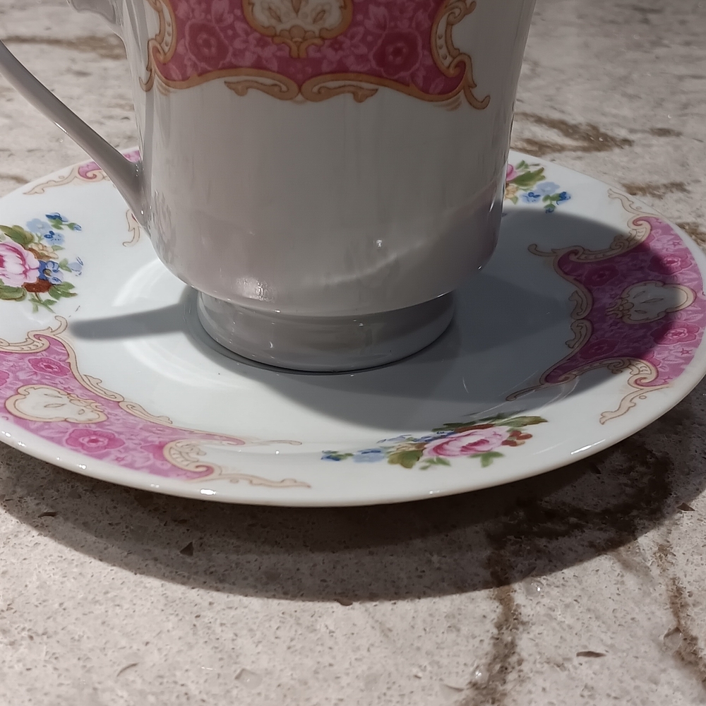 Remington fine china teacup and saucer set with a pink floral and gold trim